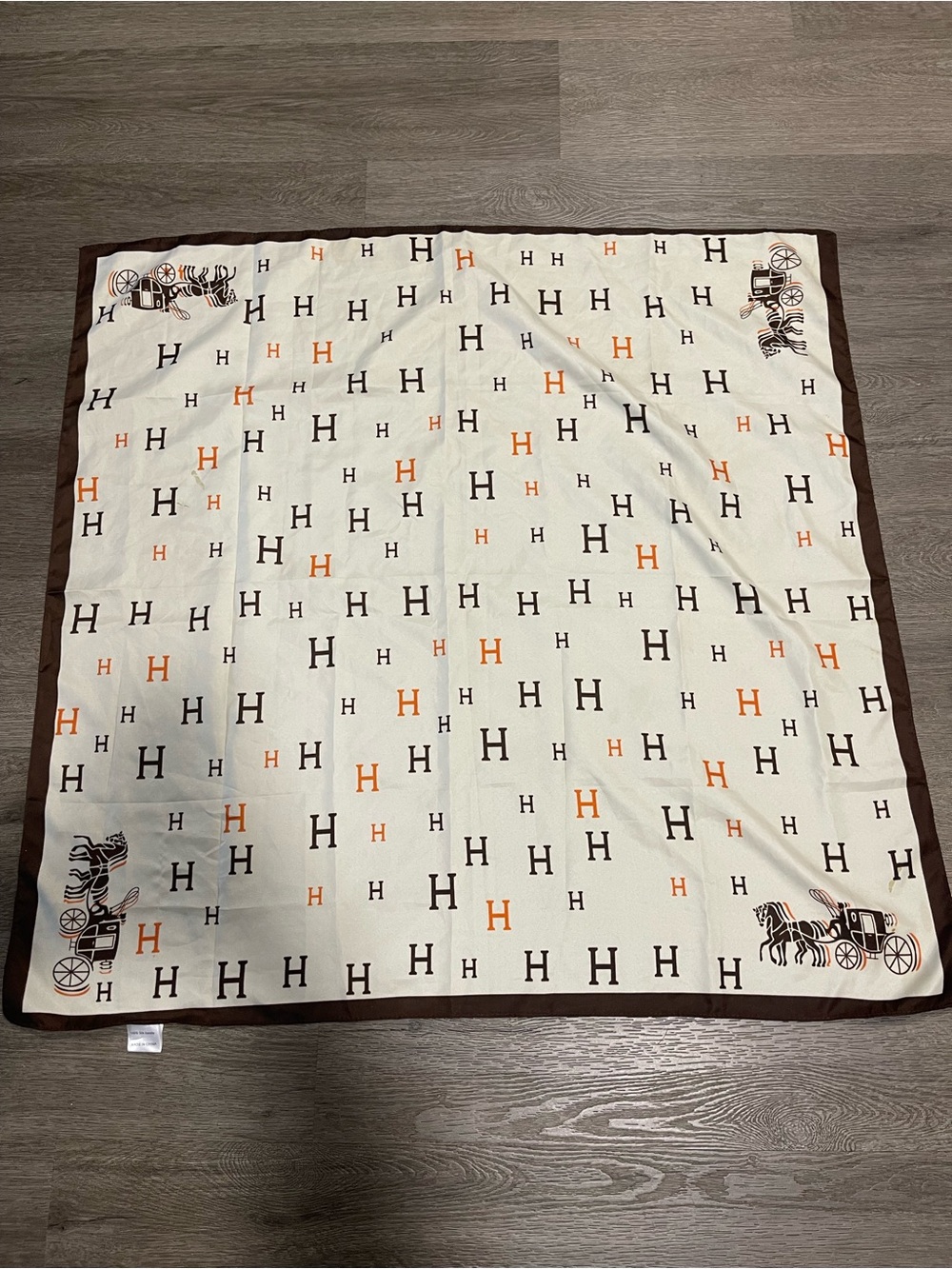Classic Ivory and Brown H-Print Silk Scarf with Orange Accents Have Spots